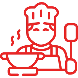 Professional chefs in Abu Dhabi preparing fresh multi-cuisine dishes in restaurant kitchen